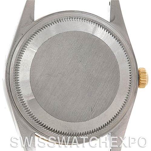 This image shows the back case and crown of a Rolex Date 15223 Men's Steel and Gold (two tone) Champagne Dial 15223 Men's Steel and Gold (two tone) Champagne Dial model watch from a top-down angle.