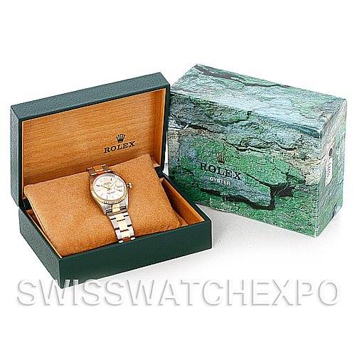 The Rolex Date 15223 Men's Steel and Gold (two tone) Silver Dial 15223 Men's Steel and Gold (two tone) Silver Dial watch is shown in its open box, alongside the closed outer box, viewed from a top-slanted angle.