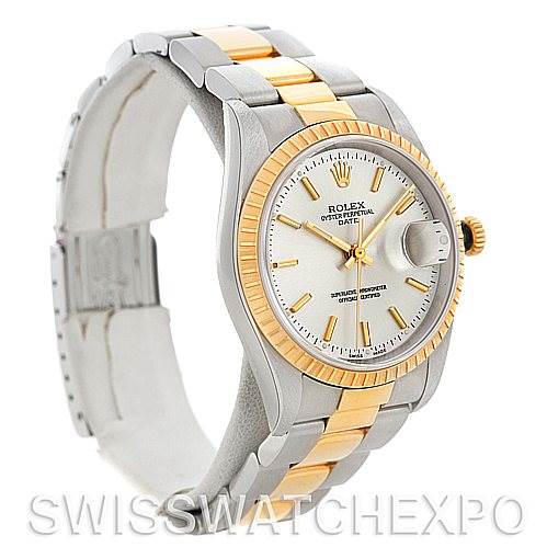 The image shows a Rolex Date 15223 Men's Steel and Gold (two tone) Silver Dial 15223 Men's Steel and Gold (two tone) Silver Dial model watch angled from the left, highlighting its bezel, dial, and part of the bracelet.