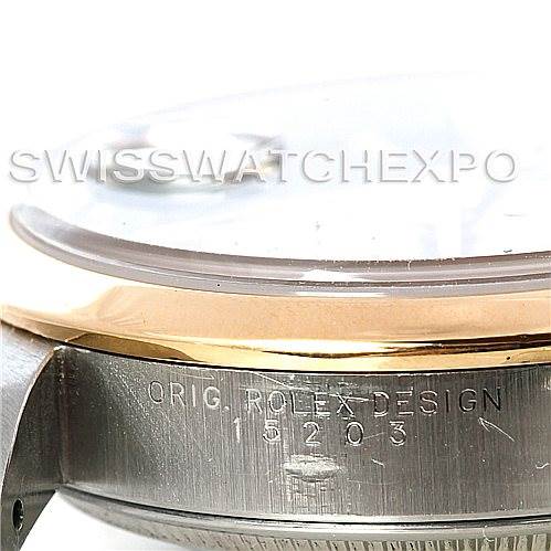 The image shows a close-up side angle of a Rolex Date 15203 Men's Steel and Gold (two tone) Black Dial 15203 Men's Steel and Gold (two tone) Black Dial model watch, highlighting the bezel, crystal, and engraved casing.