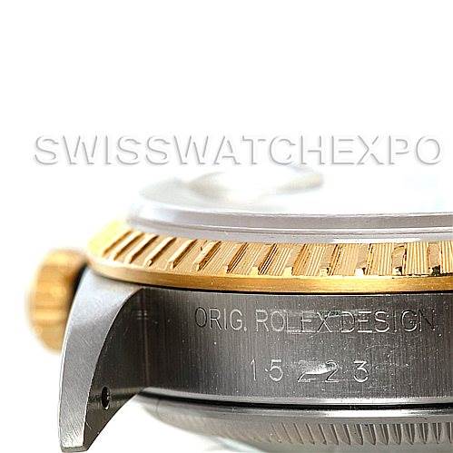 This image shows a side view of a Rolex Date 15223 Men's Steel and Gold (two tone) Silver Dial 15223 Men's Steel and Gold (two tone) Silver Dial model watch, highlighting the crown, bezel, and part of the case.