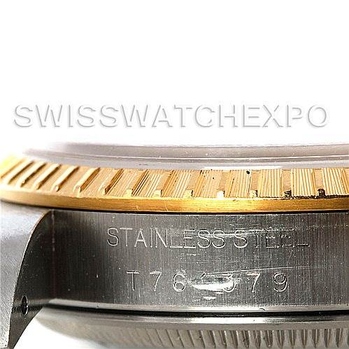 This image shows a close-up view of the side of the Rolex Date 15223 Men's Steel and Gold (two tone) Silver Dial 15223 Men's Steel and Gold (two tone) Silver Dial model watch, highlighting the stainless steel and gold bezel.