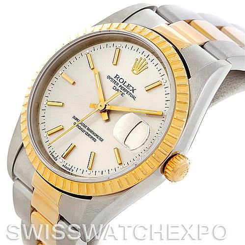 The image shows a Rolex Date 15223 Men's Steel and Gold (two tone) Silver Dial 15223 Men's Steel and Gold (two tone) Silver Dial watch in an angled view, highlighting the gold bezel, crown, and two-tone bracelet.