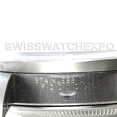 The image shows a close-up of the serial number and stainless steel engraving on the side of a Rolex Date 15210 Men's Stainless Steel Silver Dial 15210 Men's Stainless Steel Silver Dial model watch case.