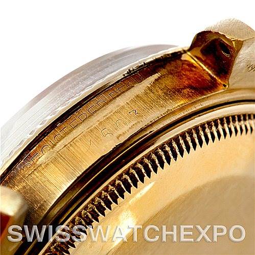 Close-up angle of the side of a Rolex Date 1503 Men's Yellow Gold Champagne Dial 1503 Men's Yellow Gold Champagne Dial model watch, focusing on the serial number engraving.