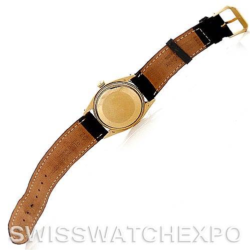 This image shows the back view of a Rolex Date 1503 Men's Yellow Gold Champagne Dial 1503 Men's Yellow Gold Champagne Dial model watch, highlighting the case back and leather strap.