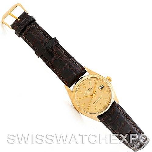 The image shows a Rolex Date 1503 Men's Yellow Gold Champagne Dial 1503 Men's Yellow Gold Champagne Dial model watch from an angled top-down view, displaying its face, bezel, lugs, and leather strap.