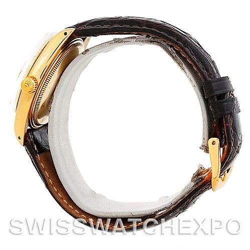 The image shows the side view of a Rolex Date 1503 Men's Yellow Gold Champagne Dial 1503 Men's Yellow Gold Champagne Dial model, highlighting the case, crown, and leather strap.