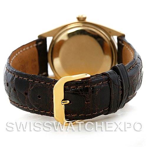 The image shows the back view of a Rolex Date 1503 Men's Yellow Gold Champagne Dial 1503 Men's Yellow Gold Champagne Dial model watch, focusing on the leather strap and gold clasp.