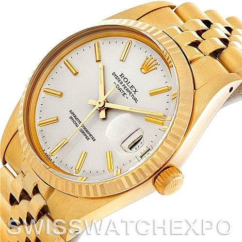 This image shows a close-up of a Rolex Date 15037 Men's Yellow Gold Silver Dial 15037 Men's Yellow Gold Silver Dial model watch, featuring the dial, crown, and part of the bracelet at an angle.