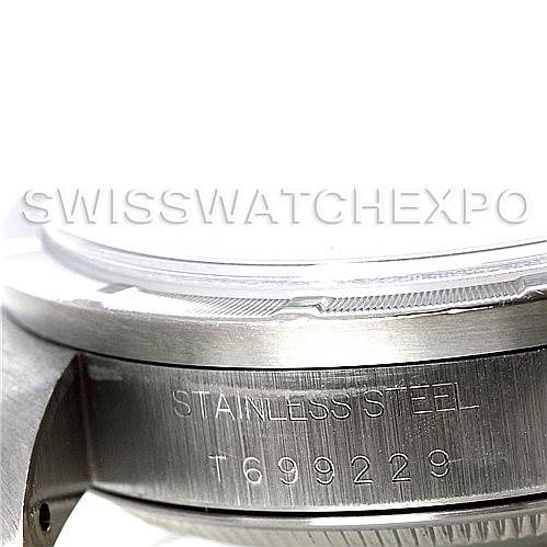 This image shows a close-up of the side of a Rolex Date 15210 Men's Stainless Steel Black Dial 15210 Men's Stainless Steel Black Dial model watch, highlighting the serial number engravings and stainless steel case.