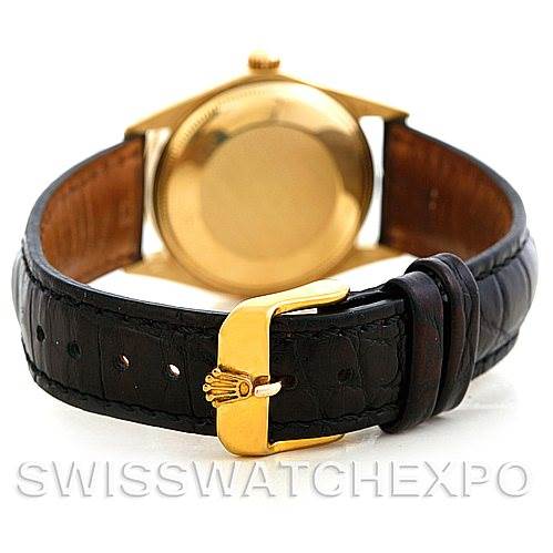 This image shows the back case, crown, and leather strap with buckle of a Rolex Date 1501 Men
s Yellow Gold Silver Dial 1501 Men
s Yellow Gold Silver Dial model watch, viewed from the rear.