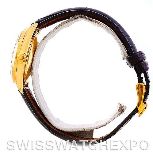 The image shows a side view of a Rolex Date 1501 Men
s Yellow Gold Silver Dial 1501 Men
s Yellow Gold Silver Dial model watch, highlighting the case, crown, and leather strap.