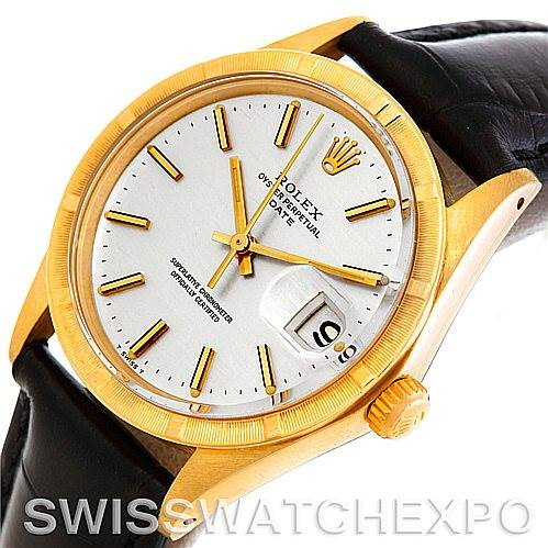 This image shows a Rolex Date 1501 Men
s Yellow Gold Silver Dial 1501 Men
s Yellow Gold Silver Dial model watch at an angled view, highlighting the dial, bezel, crown, and part of the leather strap.