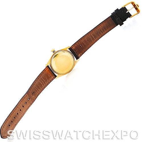 This image shows the back view of the Rolex Date 1501 Men
s Yellow Gold Silver Dial 1501 Men
s Yellow Gold Silver Dial watch, including its brown leather strap and gold buckle.