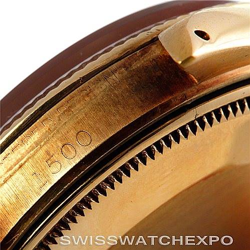 This close-up image shows the side and bezel of a Rolex Date 1500 Men's Yellow Gold Blue Dial 1500 Men's Yellow Gold Blue Dial model watch.