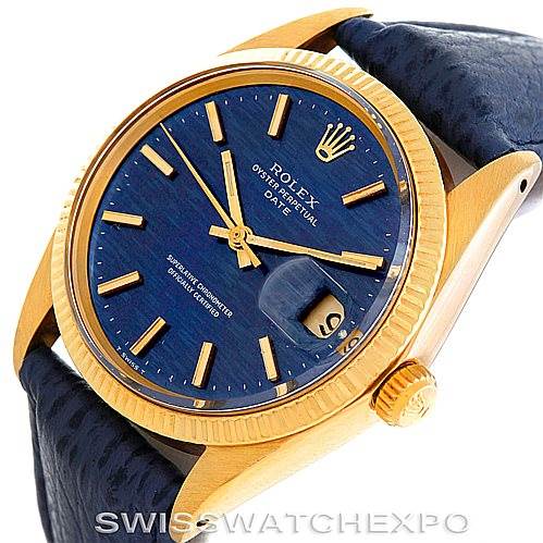 The image shows a Rolex Date 1500 Men's Yellow Gold Blue Dial 1500 Men's Yellow Gold Blue Dial watch from an angle highlighting its blue dial, golden case, and crown, with a visible date magnifier.