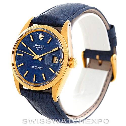 The image shows a Rolex Date 1500 Men's Yellow Gold Blue Dial 1500 Men's Yellow Gold Blue Dial model watch at a slight angle, revealing the face, bezel, crown, and part of the strap.