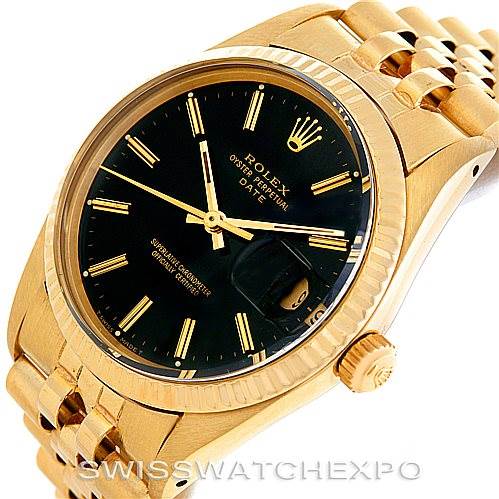 This image shows a close-up of the face and side of a Rolex Date 15037 Men's Yellow Gold Black Dial 15037 Men's Yellow Gold Black Dial watch, featuring its black dial, gold case, and bracelet.