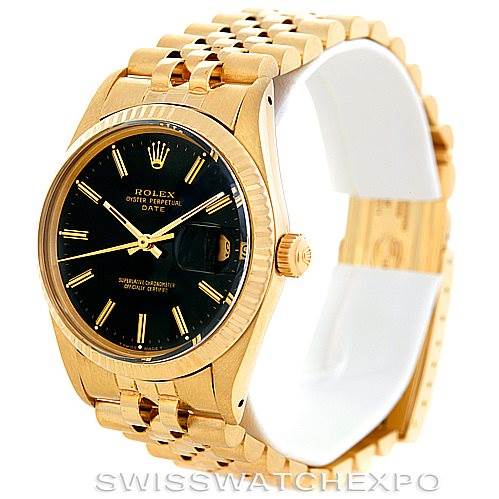 The Date model by Rolex is shown at a slightly tilted angle, highlighting its gold case, black dial, and gold bracelet.