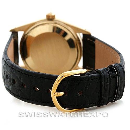 The image shows the back case and leather strap of a Rolex Date 15037 Men's Yellow Gold Black Dial 15037 Men's Yellow Gold Black Dial model watch, with the strap's buckle in focus.