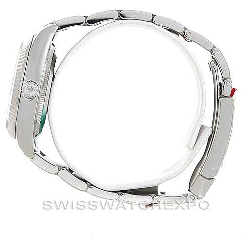 The image shows a Rolex Date 115234 Men's Stainless Steel Silver Dial 115234 Men's Stainless Steel Silver Dial model watch from a side angle, highlighting the casing, bracelet, and clasp.