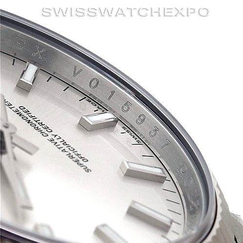 The image shows a close-up angle of the bezel and part of the dial of a Rolex Date 115234 Men's Stainless Steel Silver Dial 115234 Men's Stainless Steel Silver Dial model watch.