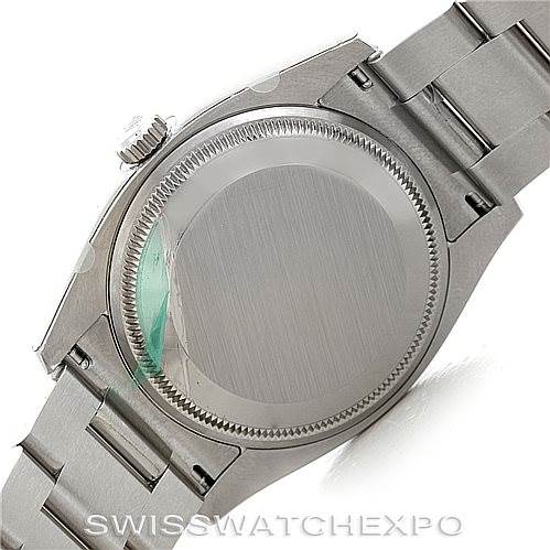 This image shows the back case and bracelet of a Rolex Date 115234 Men's Stainless Steel Silver Dial 115234 Men's Stainless Steel Silver Dial model watch, viewed from the underside.