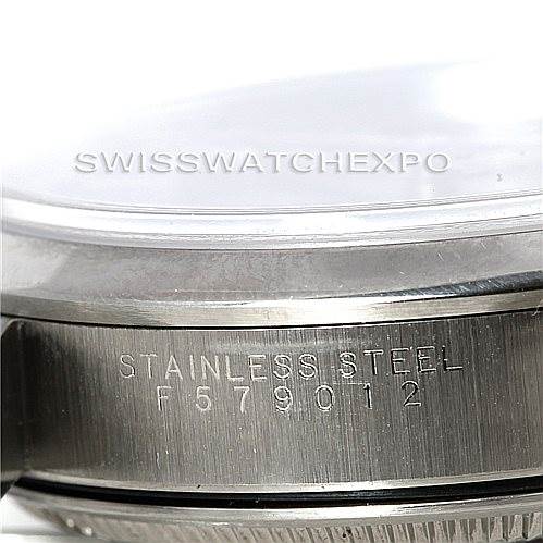 The image shows the side profile and case back of the Rolex Date 15200 Men's Stainless Steel Black Dial 15200 Men's Stainless Steel Black Dial model watch, highlighting the serial number and “STAINLESS STEEL” engraving.
