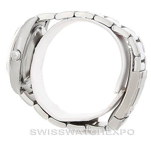 The image shows the side profile of a Rolex Date 115234 Men's Stainless Steel Pink Dial 115234 Men's Stainless Steel Pink Dial model watch, highlighting the crown and bracelet links.