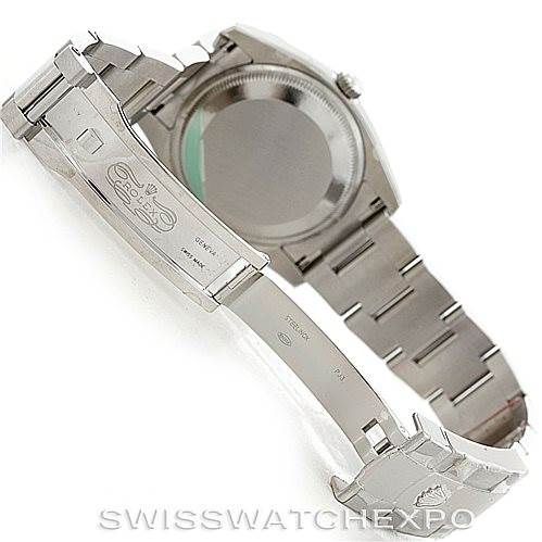 The image shows the back and partially open clasp of a Rolex Date 115234 Men's Stainless Steel Pink Dial 115234 Men's Stainless Steel Pink Dial model watch, highlighting the bracelet and clasp mechanism.