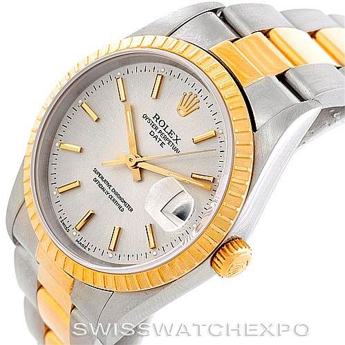 This image shows the face, bezel, and part of the bracelet of a Rolex Date 15223 Men's Steel and Gold (two tone) Silver Dial 15223 Men's Steel and Gold (two tone) Silver Dial model watch with a two-tone design.