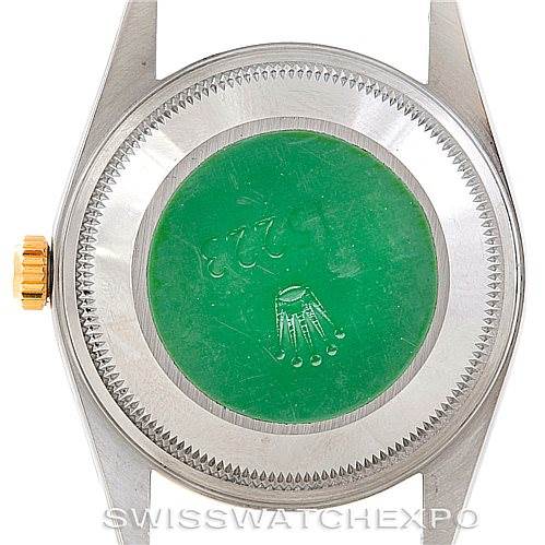 The image shows the case back and crown of a Rolex Date 15223 Men's Steel and Gold (two tone) Champagne Dial 15223 Men's Steel and Gold (two tone) Champagne Dial model watch.