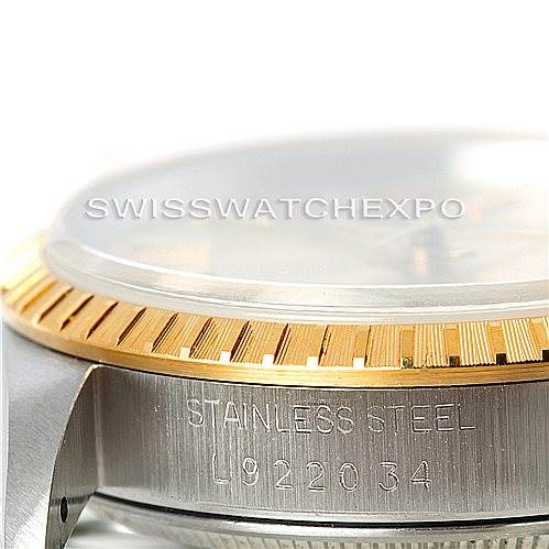 This image shows a close-up side view of the Rolex Date 15223 Men's Steel and Gold (two tone) Champagne Dial 15223 Men's Steel and Gold (two tone) Champagne Dial model, highlighting its case, bezel, and serial number.