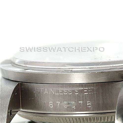The image shows a close-up side view of a Rolex Date 15210 Men's Stainless Steel Silver Dial 15210 Men's Stainless Steel Silver Dial model watch, focusing on the stainless steel case and serial number.