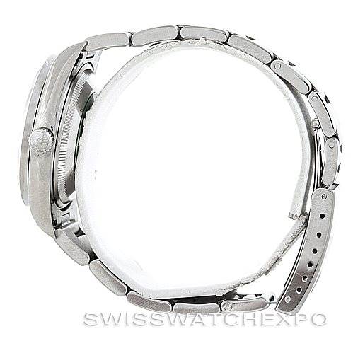 The side view of this Rolex Date 15210 Men's Stainless Steel Silver Dial 15210 Men's Stainless Steel Silver Dial model watch shows the case, crown, and bracelet.