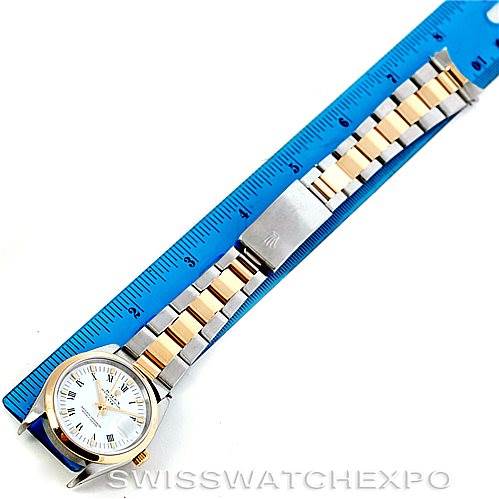 This image shows a Rolex Date 15203 Men's Steel and Gold (two tone) White Dial 15203 Men's Steel and Gold (two tone) White Dial model watch laid flat with a ruler above it, displaying the face and full bracelet.