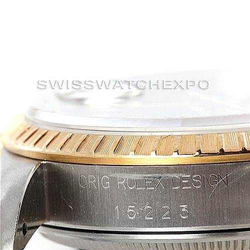 The image shows a close-up of the side and bezel of the Rolex Date 15223 Men's Steel and Gold (two tone) Blue Dial 15223 Men's Steel and Gold (two tone) Blue Dial model watch, displaying the "Orig Rolex Design" engraving and model number.