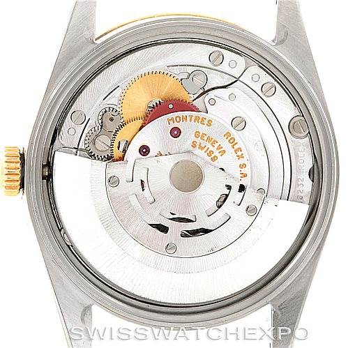 This image shows the open case back of a Rolex Date 15223 Men's Steel and Gold (two tone) Blue Dial 15223 Men's Steel and Gold (two tone) Blue Dial model, revealing the intricate inner movement parts.