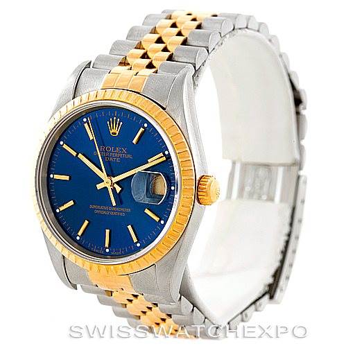 This image shows a Rolex Date 15223 Men's Steel and Gold (two tone) Blue Dial 15223 Men's Steel and Gold (two tone) Blue Dial model watch from an angled front view, highlighting its blue dial, gold bezel, and two-tone bracelet.