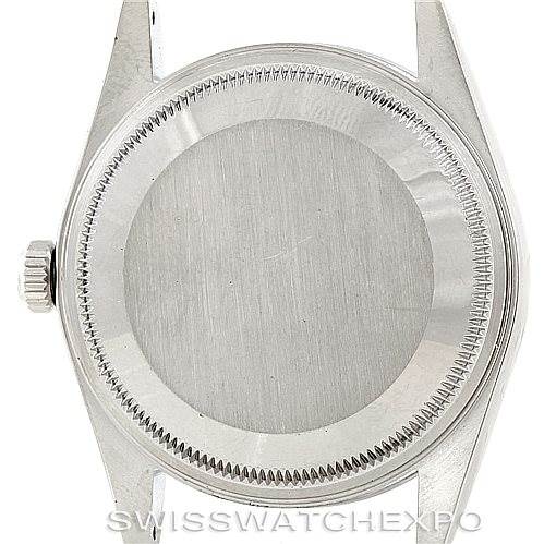 The image shows the back case and crown of a Rolex Date 15200 Men's Stainless Steel Blue Dial 15200 Men's Stainless Steel Blue Dial model watch from a top-down angle.