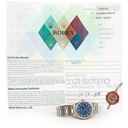 The image shows a Rolex Date 15200 Men's Stainless Steel Blue Dial 15200 Men's Stainless Steel Blue Dial model watch and its warranty certificate, viewed from a front angle.