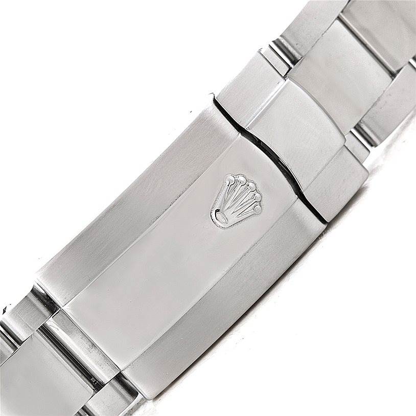 The image shows a close-up of the clasp with the Rolex crown logo on the bracelet of a Rolex Date 115200 Men's Stainless Steel Blue Dial 115200 Men's Stainless Steel Blue Dial model watch.