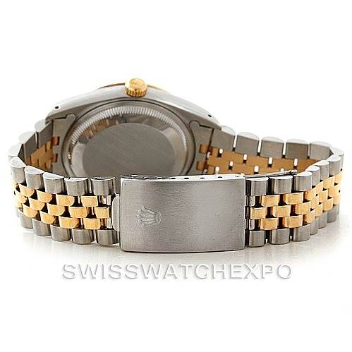 The image shows the back view of a Rolex Date 15223 Men's Steel and Gold (two tone) Champagne Dial 15223 Men's Steel and Gold (two tone) Champagne Dial model watch, highlighting its two-tone bracelet and clasp with the Rolex logo.