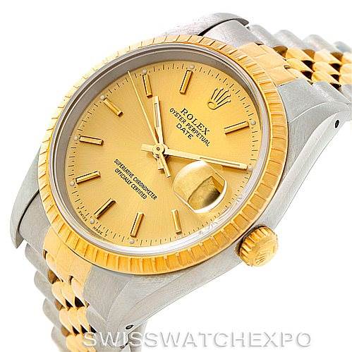 The image shows a close-up, angled view of the Rolex Date 15223 Men's Steel and Gold (two tone) Champagne Dial 15223 Men's Steel and Gold (two tone) Champagne Dial model, highlighting the gold bezel, crown, and part of the bracelet.