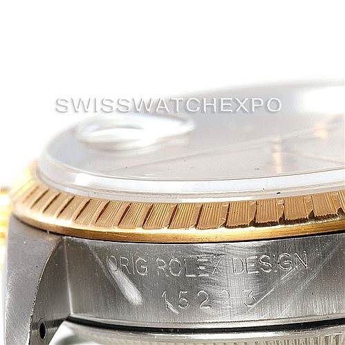 This image shows a close-up of the side and part of the bezel of a Rolex Date 15223 Men's Steel and Gold (two tone) Champagne Dial 15223 Men's Steel and Gold (two tone) Champagne Dial model, displaying the model number "15223."