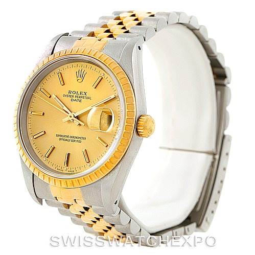 This image shows a Rolex Date 15223 Men's Steel and Gold (two tone) Champagne Dial 15223 Men's Steel and Gold (two tone) Champagne Dial model watch at a side angle, highlighting its gold bezel, crown, and two-tone bracelet.