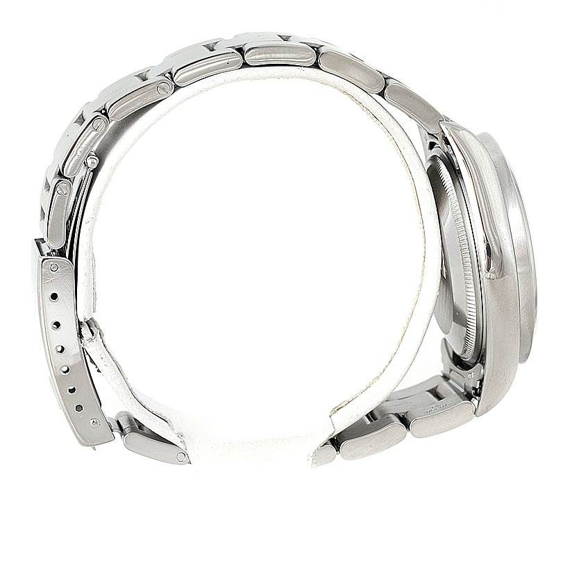 The image shows a side view of a Rolex Date 15210 Men's Stainless Steel White Dial 15210 Men's Stainless Steel White Dial model watch, highlighting its metal bracelet and case.