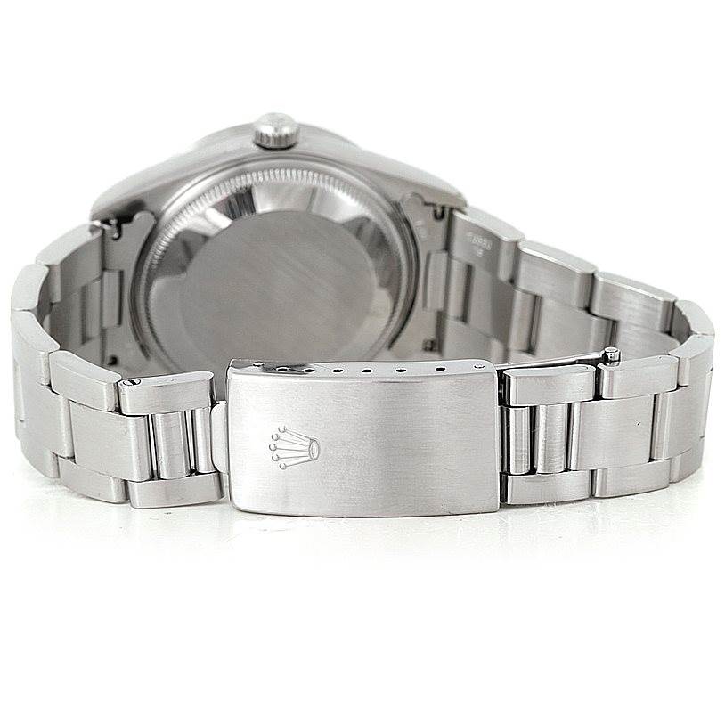 The image shows the back view of a Rolex Date 15210 Men's Stainless Steel White Dial 15210 Men's Stainless Steel White Dial model watch, highlighting its clasp and bracelet.