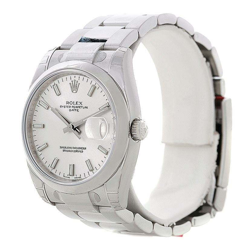 The image shows a Rolex Date 115200 Men's Stainless Steel Silver Dial 115200 Men's Stainless Steel Silver Dial model watch from a profile and front angle, highlighting the dial, crown, and bracelet.